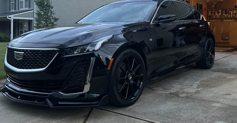 Mobile ceramic coating in Charlotte: Black Cadillac CT5 with glossy paint after a detail