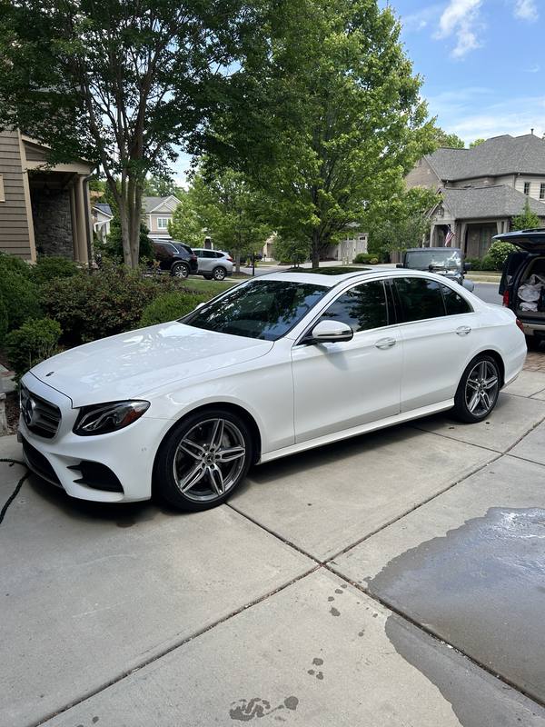 Mobile car detailing in Fort Mill, SC: White Mercedes-Benz E-Class sedan in a driveway after a mobile detail