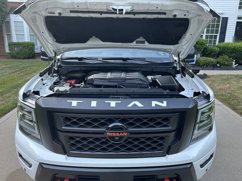 Mobile car detailing in Charlotte, NC: Nissan Titan PRO-4X with the hood open, showing a clean engine bay