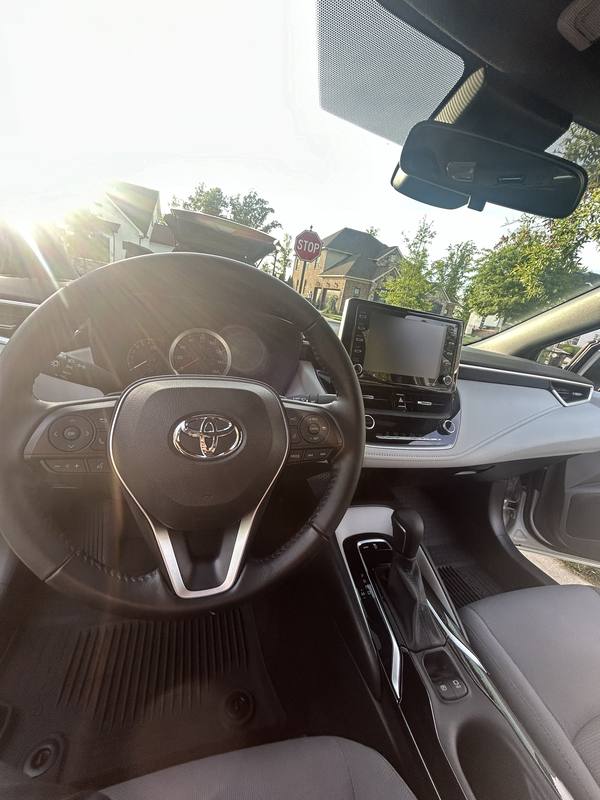 Mobile interior detailing in Charlotte: Toyota Corolla dashboard and gray interior after an interior detail
